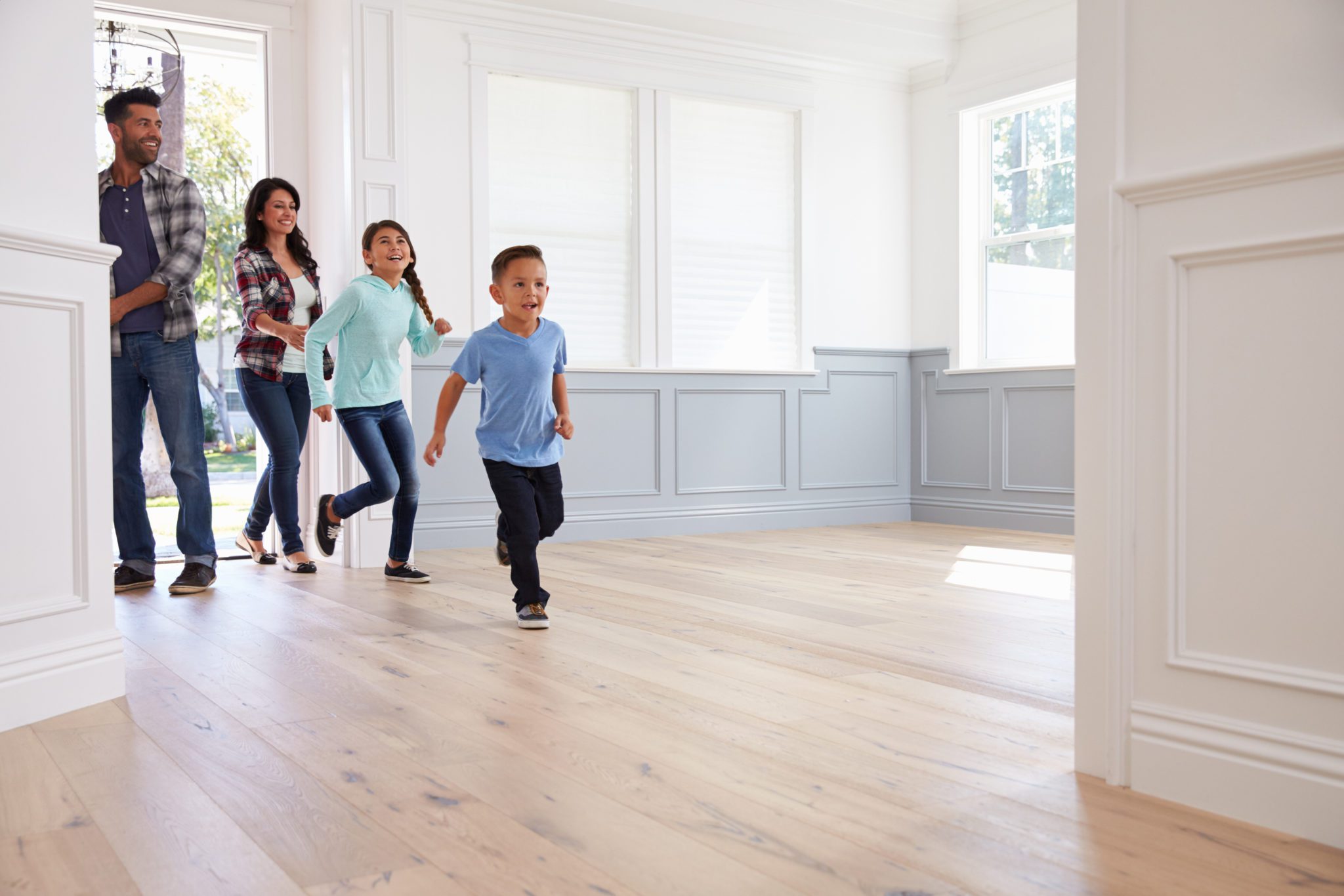 Family entering a home